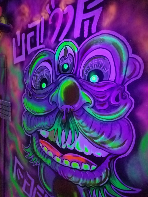 Come Together Blacklight UV mural by Become More in Union Station - Graffiti Attic KC