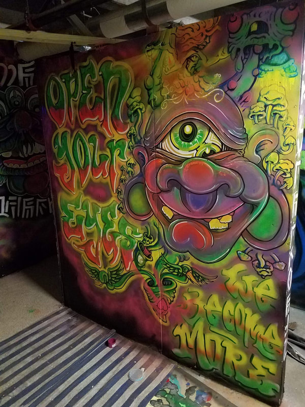 Open Your Eyes -  Black-light UV mural by Become More in Union Station - Graffiti Attic KC